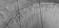 Close view of layers in crater, as seen by HiRISE under HiWish program.  Dark line are defects in image.  This image was taken during a global dust storm.