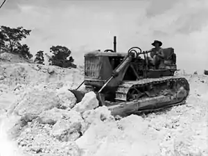 A No. 5 Airfield Construction Squadron bulldozer working in a coral quarry at Noemfoor Island during December 1944