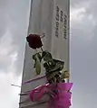 Floral tribute on a pillar