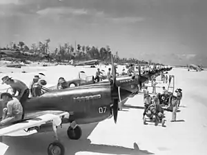 No. 80 Squadron Kittyhawks being prepared for ground attack missions in 1944