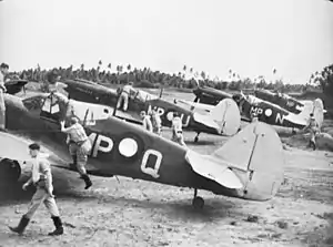 Members of No. 86 Squadron RAAF about to take off in their Kittyhawk fighters at Merauke in April 1944