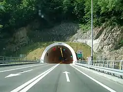 Road tunnel portal with variable traffic signs placed above the tunnel entrance