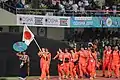 Athletes from Japan bearing the national flag during the opening ceremony.