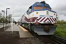 An Altamont Commuter Express train leaving Pleasanton Station