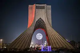 Azadi Tower during a full moon