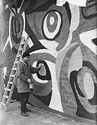 'Karel Appel, making a wall-painting in Rotterdam', 1955