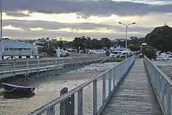 The sun setting at the Ōmokoroa wharf