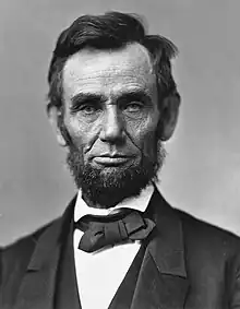 Abraham Lincoln is a dark-haired man with a beard but no moustache.