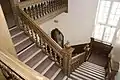 The main staircase showing the filled helix balustrade used in the upper floors.