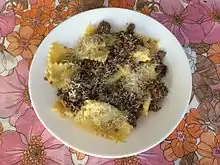 A dish of dry Pavese agnolotti, a type of stuffed pasta, with a Pavese stew-based sauce