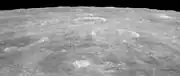 Oblique view facing south from Apollo 15, with Agrippa right of center, and the crater Godin above center showing bright rays.