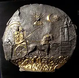 The sixteen-rayed "Vergina Sun" design on the "Cybele Plaque" from Ai Khanoum, Bactria (3rd century BC). The "sunburst" here represents a star, not the Sun, shown in a star and crescent configuration alongside Helios, who is shown separately in the form of a bust with a rayed halo of thirteen rays.