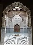 A lambrequin or "muqarnas" arch with muqarnas decoration in the Madrasa al-Attarine, Fes (1323-1325)