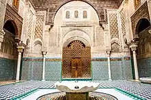 Interior facade of Al-Attarine Madrasa, showing ornate decoration