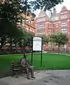 Alan Turing Memorial with the Engineering and Physical Sciences faculty office of the University of Manchester in the background.