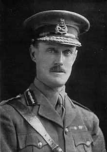 head and shoulders portrait of man in military uniform and hat