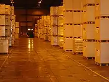 Photograph of rows of shelves with boxes on them