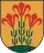 A coat of arms depicting three flowers that have red petals, green stalks, and green leaves all sprouting from green earth