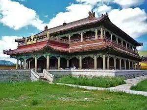 Pagoda-style temple against a partly-cloudy sky