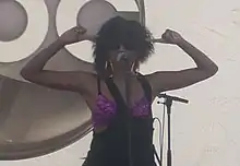 A woman singing into a microphone