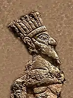 Prisoner king (detail). He appears to be wearing a crown.