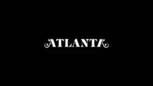 On a black background, the word Atlanta is written in white block capital letters, the first and last letter A have extra stylized curls.