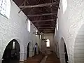 The exposed timber ceiling