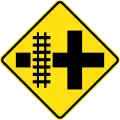 (W7-13) Railway Level Crossing on Crossroad (left)