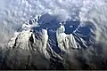 Astronaut photograph highlighting the summit crater and snow-covered slopes of the Avachinsky.