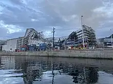  The damaged roof of Børsen and the scaffolding caving in