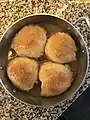 baked dumplings in their baking dish.