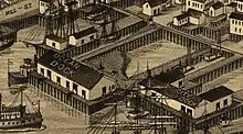 A bird's eye view map, showing an island enclosed by various piers and warehouses labeled OCEAN DOCK and CITY DOCK