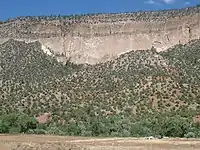 Bandelier Tuff at San Diego Canyon, New Mexico, USA. The lower Otowi Member is a single massive cooling unit, while the upper Tshirege Member is composed of multiple cooling units.