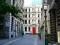 Victorian architecture featuring ornate heritage lamp posts and bluestone alleys in Bank Place, Melbourne.