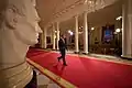 President Barack Obama walks through the Cross Hall to the East Room to present a televised press conference, 2009.