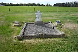 Barrhill Cemetery, with the trees of the village in the background