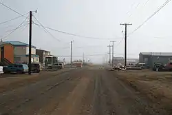 Street view of Utqiagvik in July 2008. This street, like all the others in Utqiagvik, has been left unpaved due to the prevalence of permafrost.