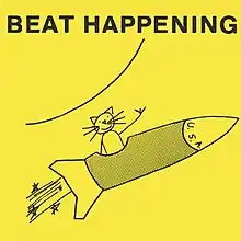 A drawing of a kitten riding on a rocket ship against a yellow background with the band's name at the top