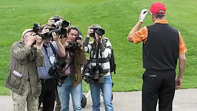 A group photographing retired footballer Franz Beckenbauer.