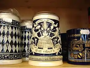 An ornate stoneware beer stein