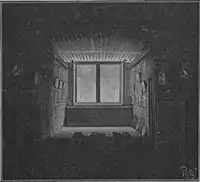 Woodcut? of a deep, shadowy room with light only near the window at the far end