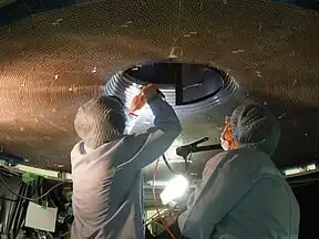 Construction work on the Central Drift Chamber (CDC) of the Belle II experiment