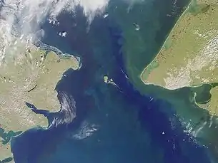 Bering Strait. Port Clarence bay is the large bight in the  southeast.