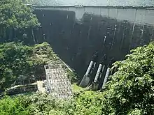 Bhumibol Dam, 154 metres (505 ft) long, creating a reservoir with a surface area of 300 square kilometres (120 sq mi).