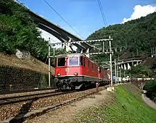 An Re 420 and Re 620 lead a freight train down the Gotthard route