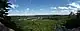 Landscape with cloud-flecked sky