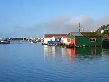 Picture of boatsheds and reflections on water