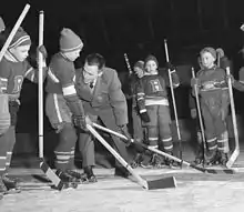 Coach demonstrating skill to players