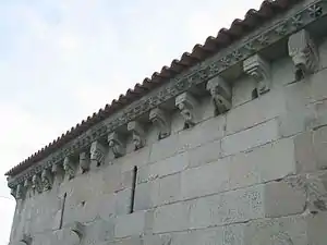 A complete row of modillions at a corbel table in the Church of São Gens de Boelhe.