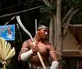 A bokator martial artist carrying a phkak, a traditional Khmer axe.